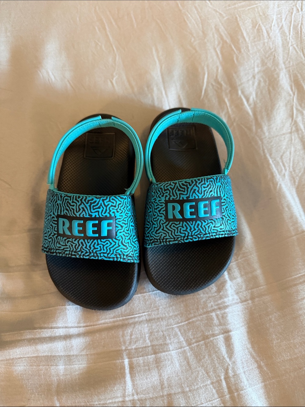 Reef Kids Turquoise Patterned Slide Sandals with Black Footbed